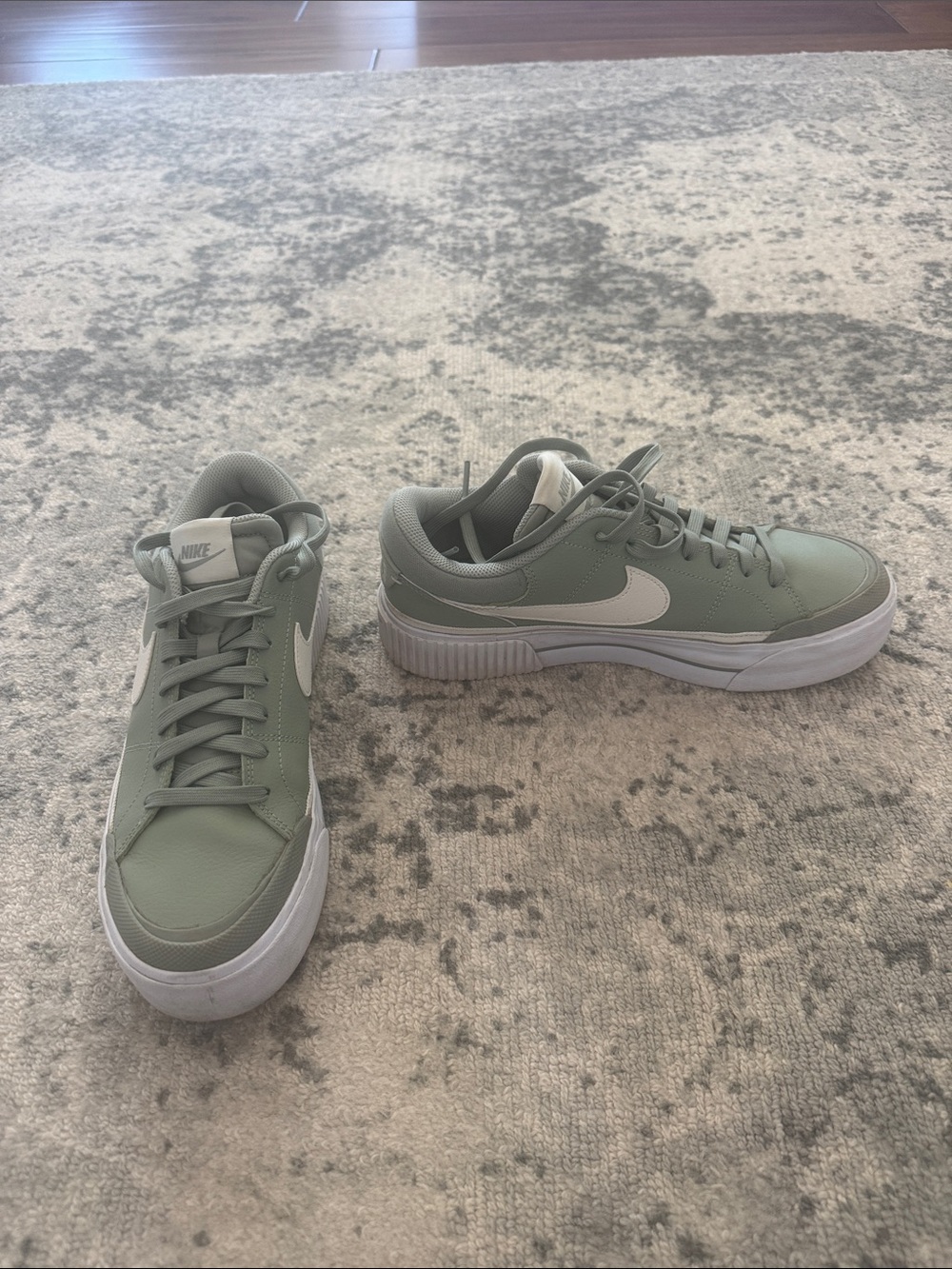 Nike Women’s Low-Top Sneakers in Sage Green and White Swoosh
